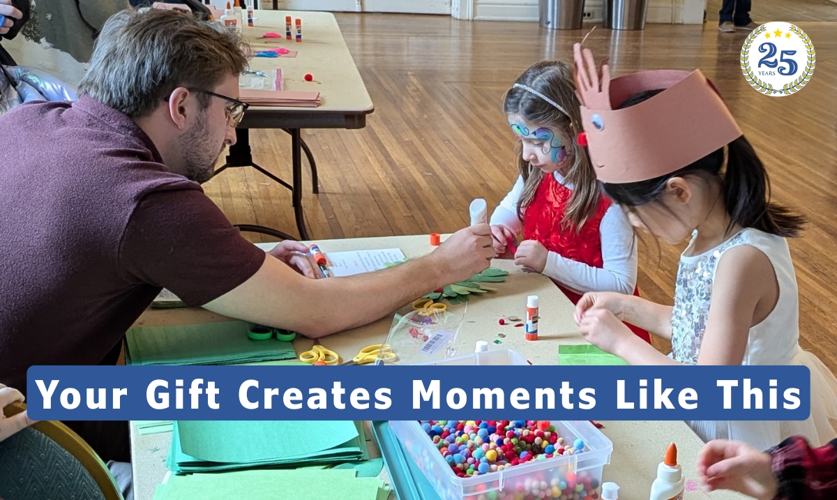 Volunteer helping young people create a Holiday craft.